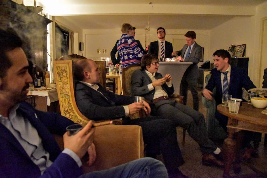 Whiskey and cigars being enjoyed in a social setting by Duitenberg members